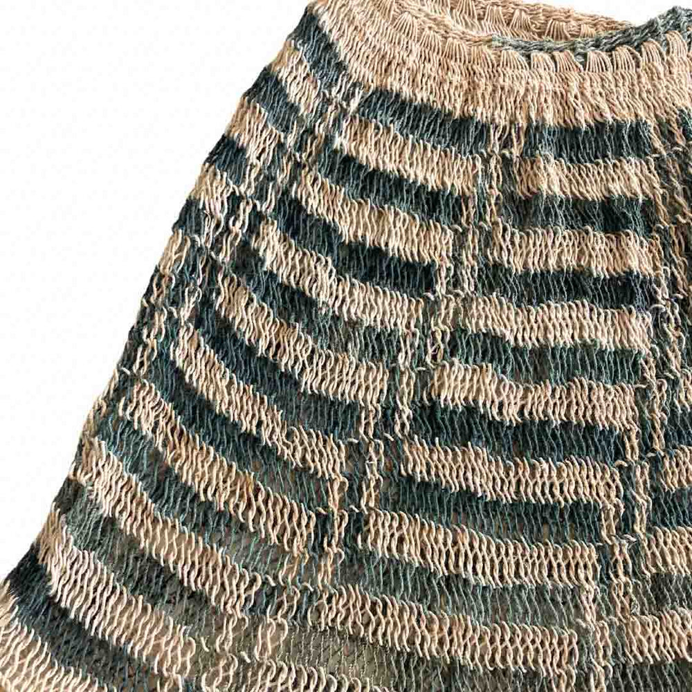 Corner close up on blue and white natural fibre bilum bag.