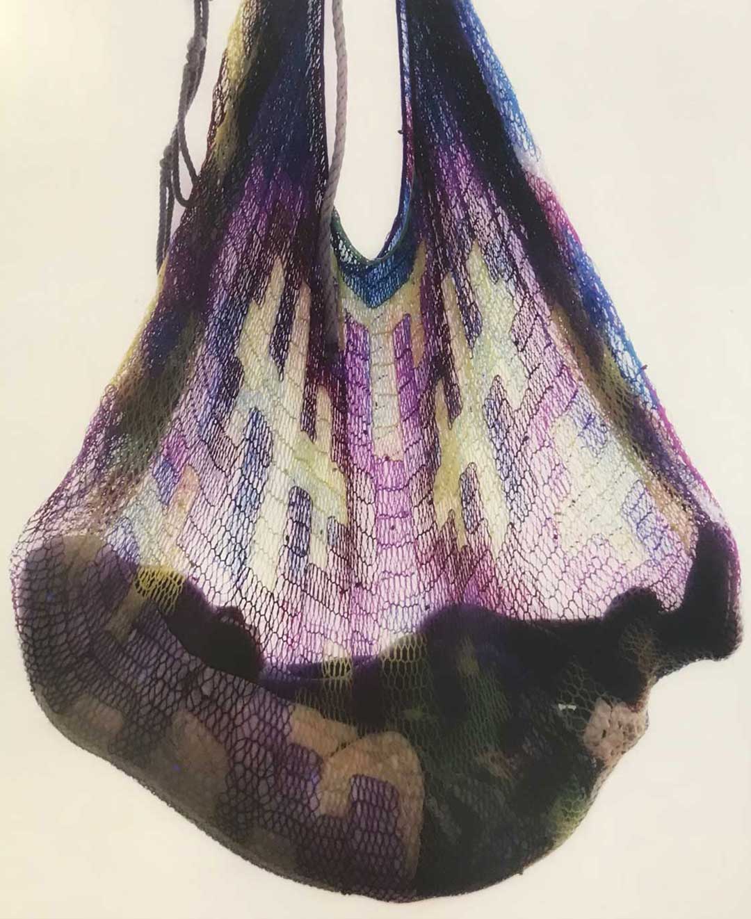 Baby sleeping in a bilum hammock hanging