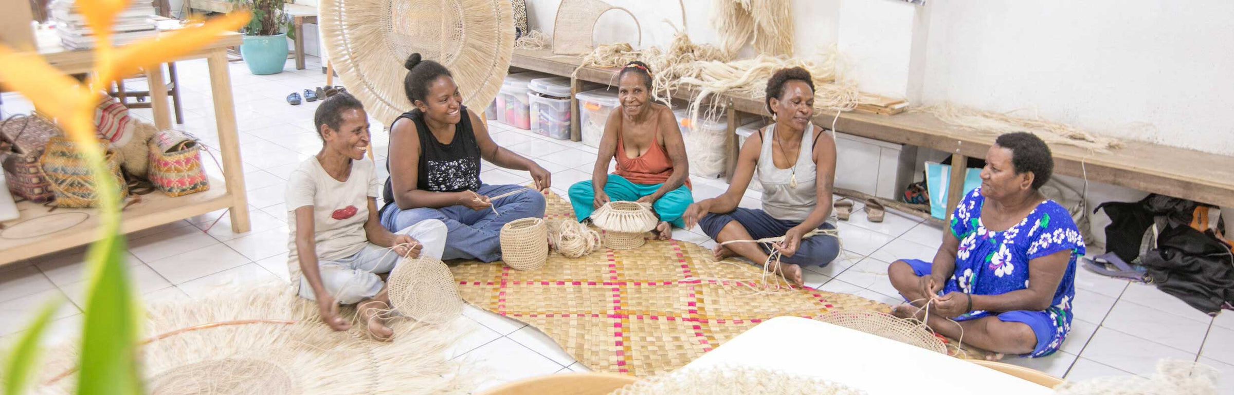 Bilum and Bilas artisan team collaborating and weaving in the Bilum and Bilas Studio in Port Moresby.