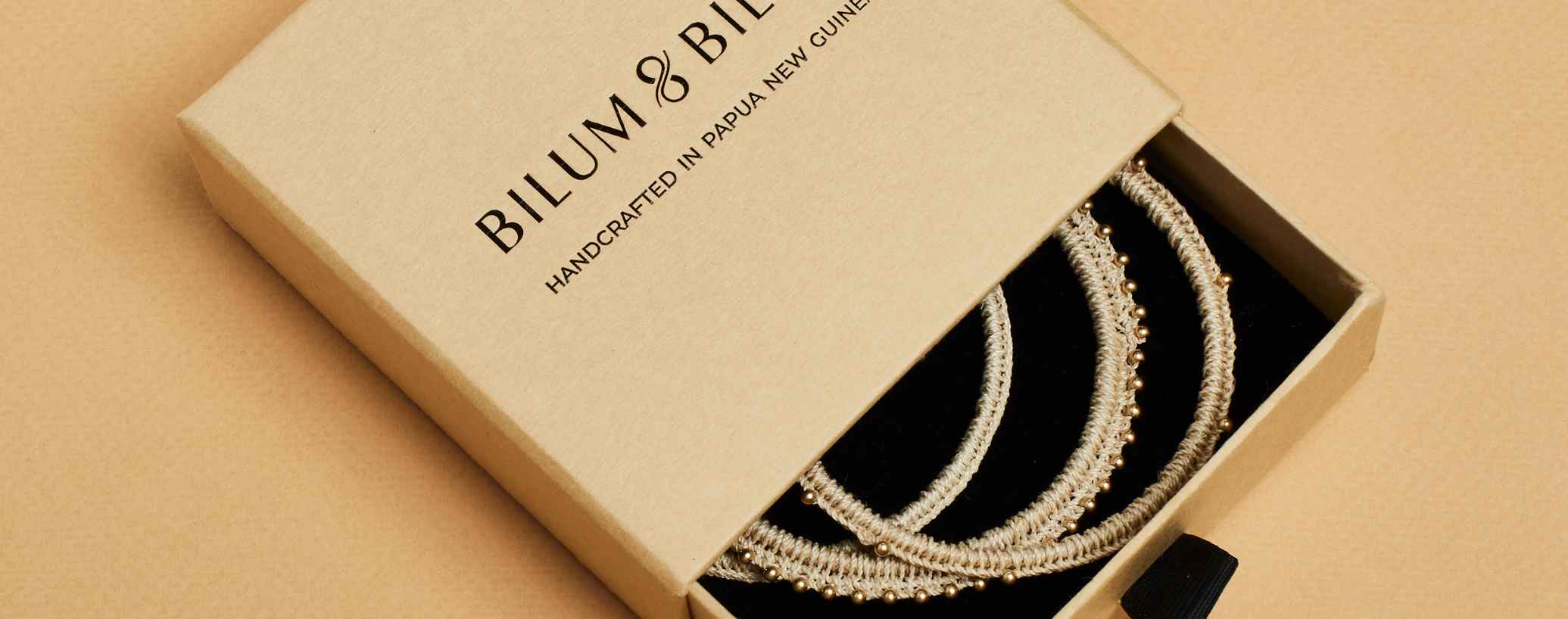 Bilum and Bilas bracelets in a Bilum and Bilas branded jewellery box 