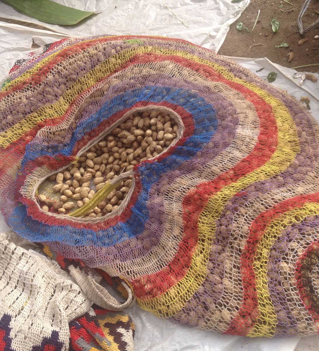 Peanuts being stored and carried in an enormous bilum at the markets