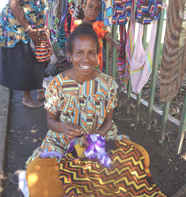 Bilum weaver at the market from a Bilum and Bilas shopping trip to Mt Hagen