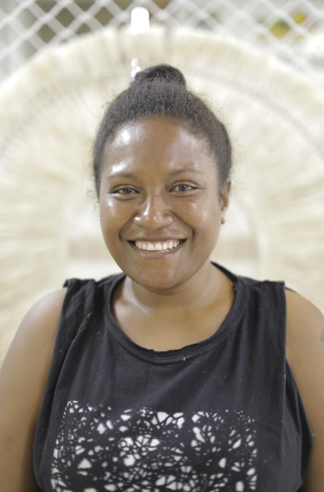 Portrait photo of Maureen Charlie artisan and Manager at Bilum and Bilas