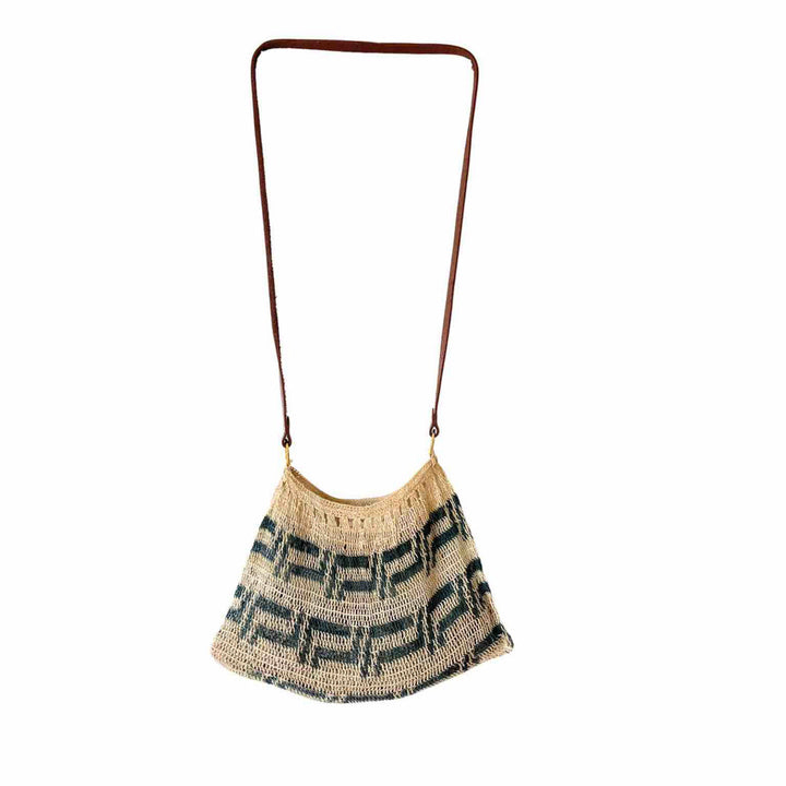Blue and white leather strap bilum hanging on white background.