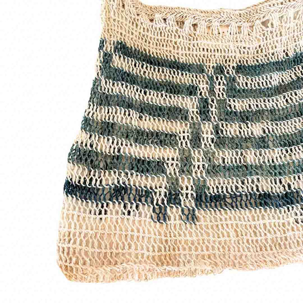 Close up on the pattern of a blue and white natural fibre bilum from PNG.