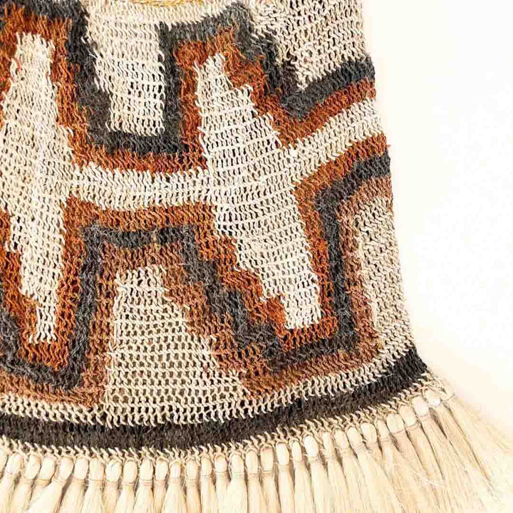Corner close up of Traditionally patterned bilum with fringing.