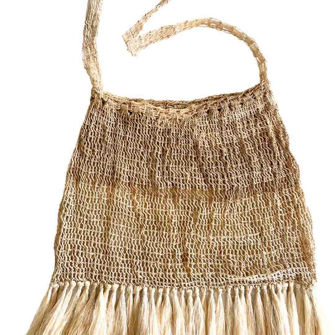 Flat lay of plain fringed bilum.