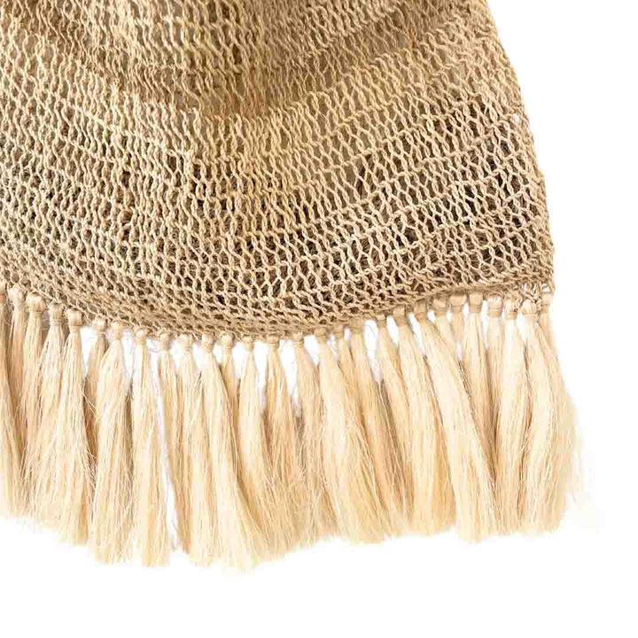 Plain natural fibre bilum with fringing detail.