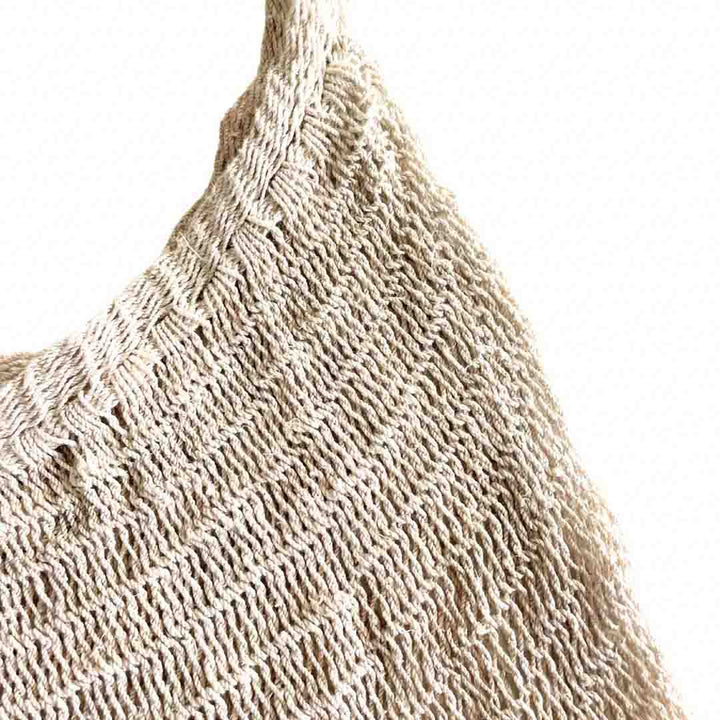 Close up on the opening of a plain natural fibre bilum.
