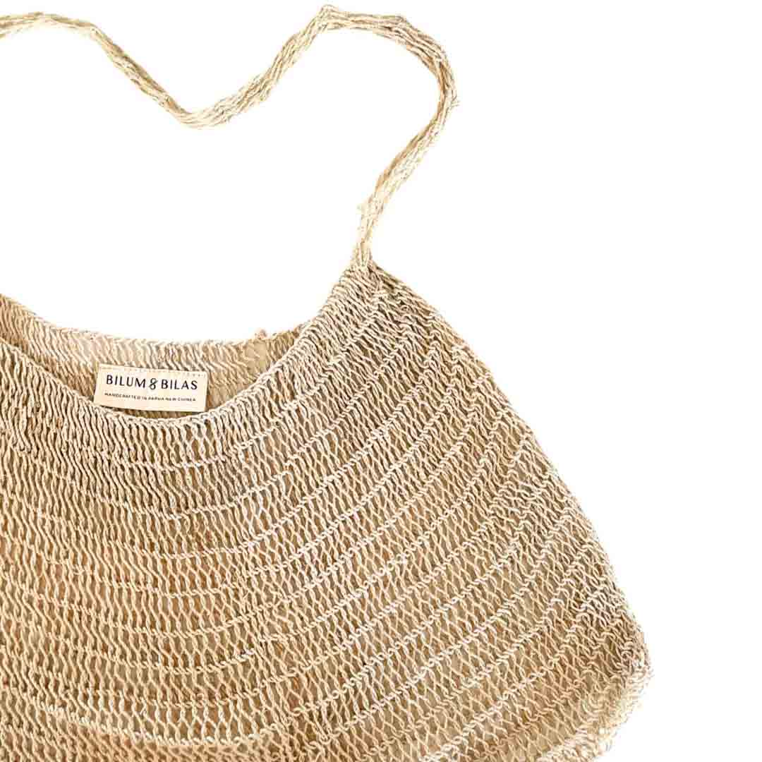 Close up on opening of plain natural fibre bilum.