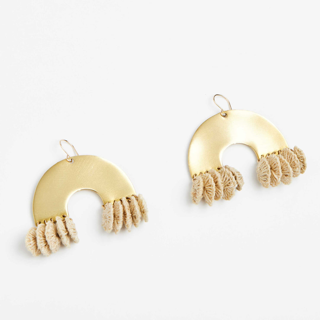 Close up angle of brass and textile rainbow look earrings front view