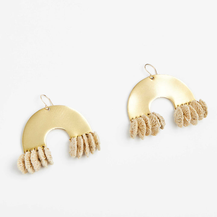 Close up angle of brass and textile rainbow look earrings front view