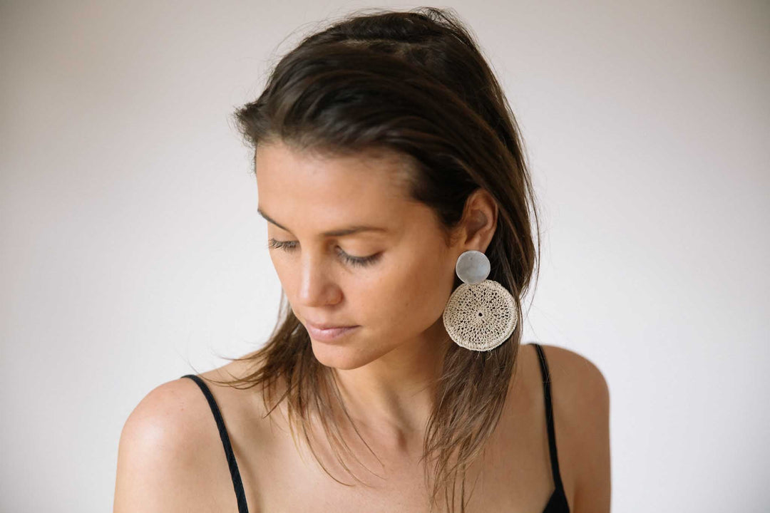 Model wearing Bilum and Bilas oversized ethical boho chic statement earrings