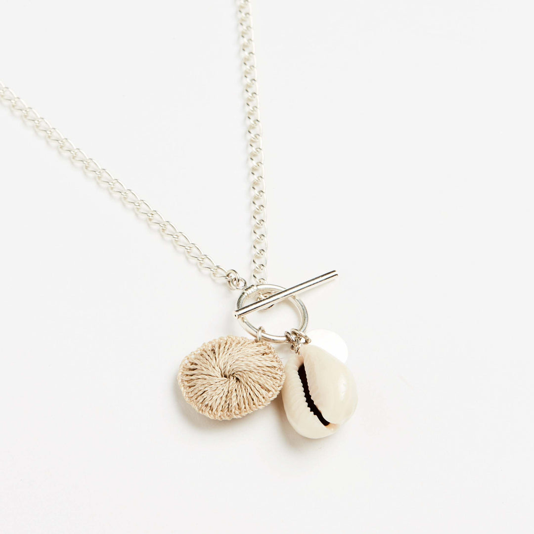 Thick silver curb chain Totem Cluster necklace by Bilum and Bilas with Pacific charms and toggle claps side