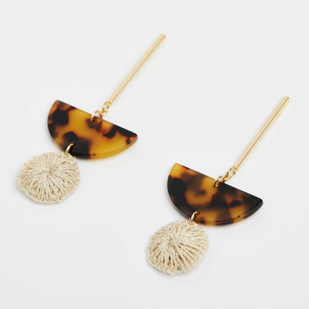 Bilum and Bilas textile and resin drop earrings with gold, fake turtle shell semi circle and textile bead angle view