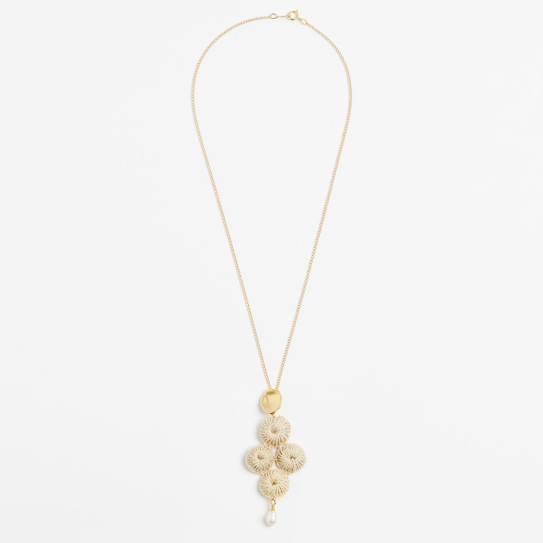 Gold filled chain necklace with pearl and woven natural fibre pendant front view