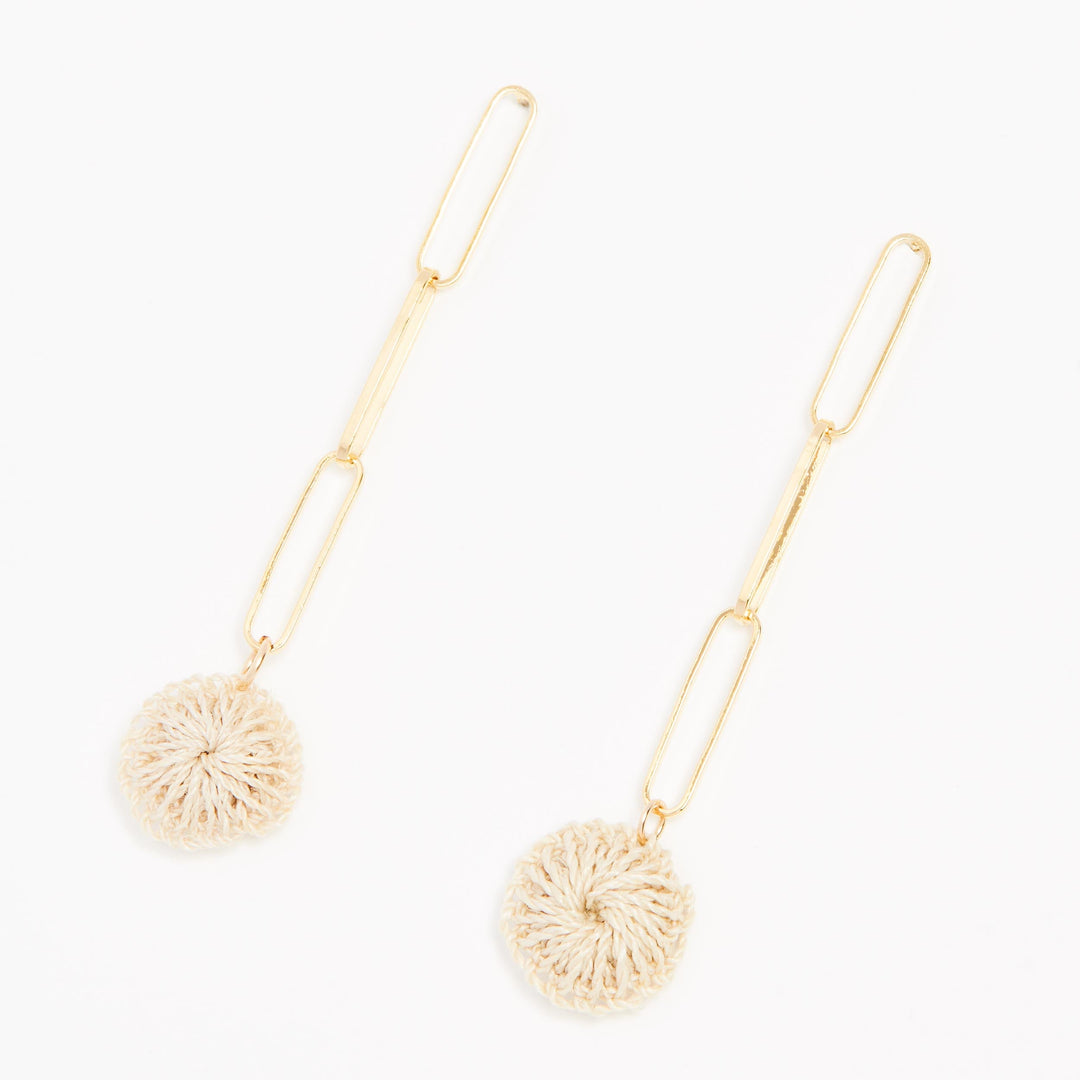 Gold paperclip chain dangle earrings with natural fibre woven disc on a right angle