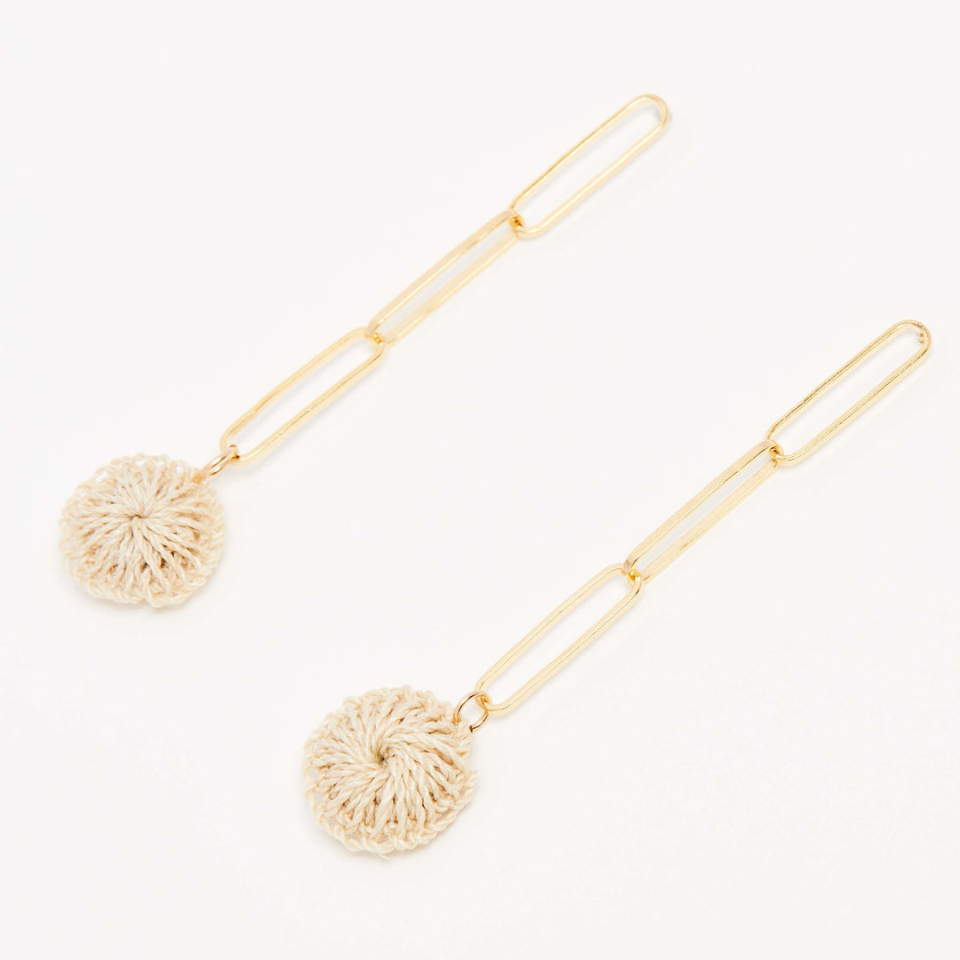 Gold paperclip chain dangle earrings with natural fibre woven disc on angle