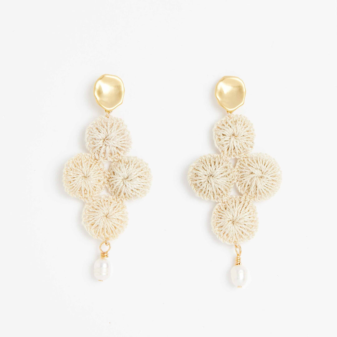 Gold Malalo Breeze earrings with pearl and natural fibre front view