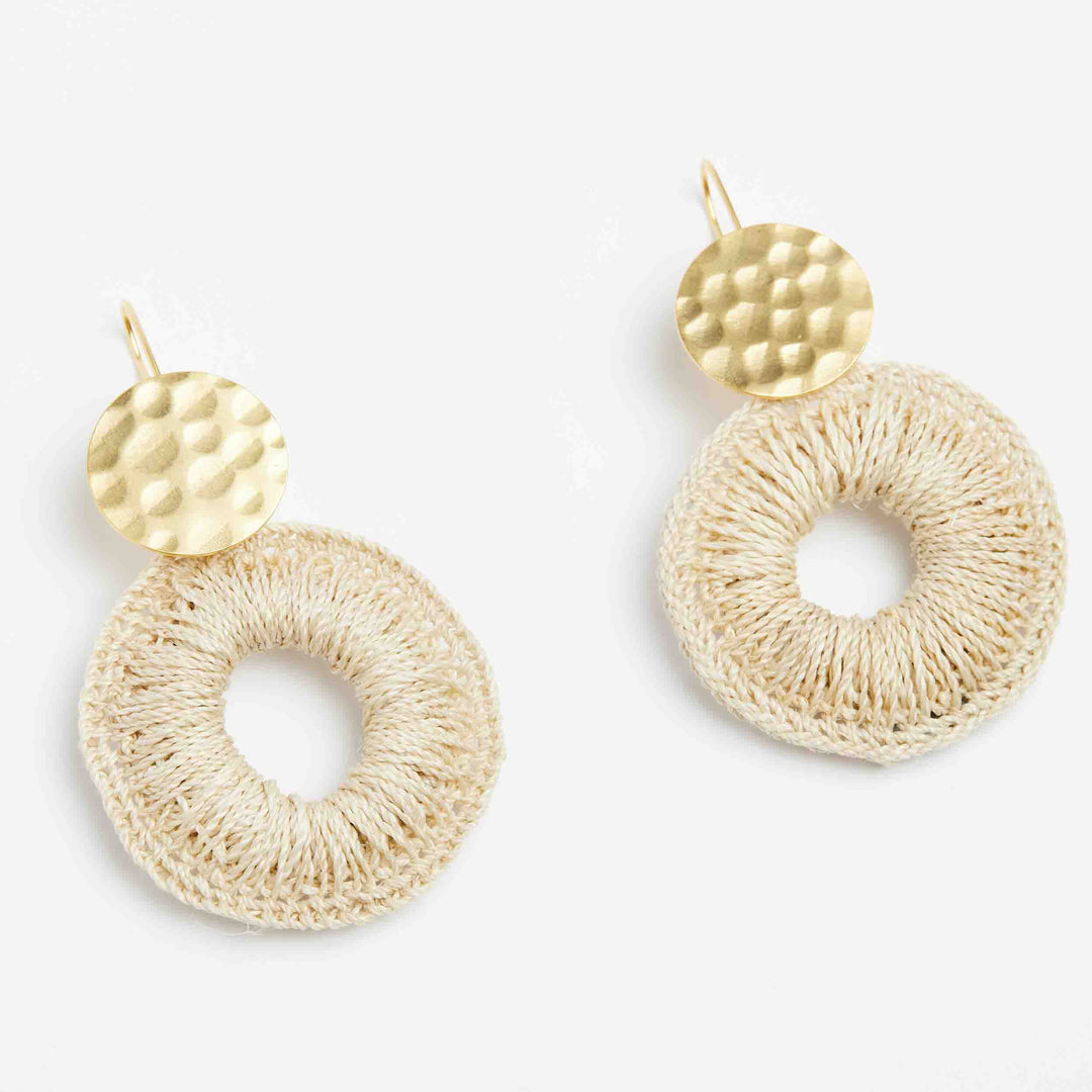 Bilum and Bilas gold disc earrings with natural fibre woven hoop earrings angled view