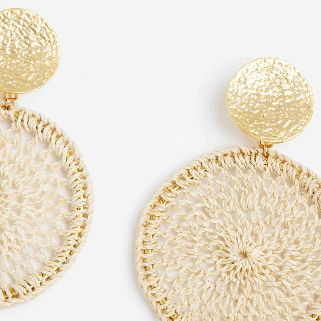 Close up Bilum and Bilas handwoven natural fibre and gold disc earrings