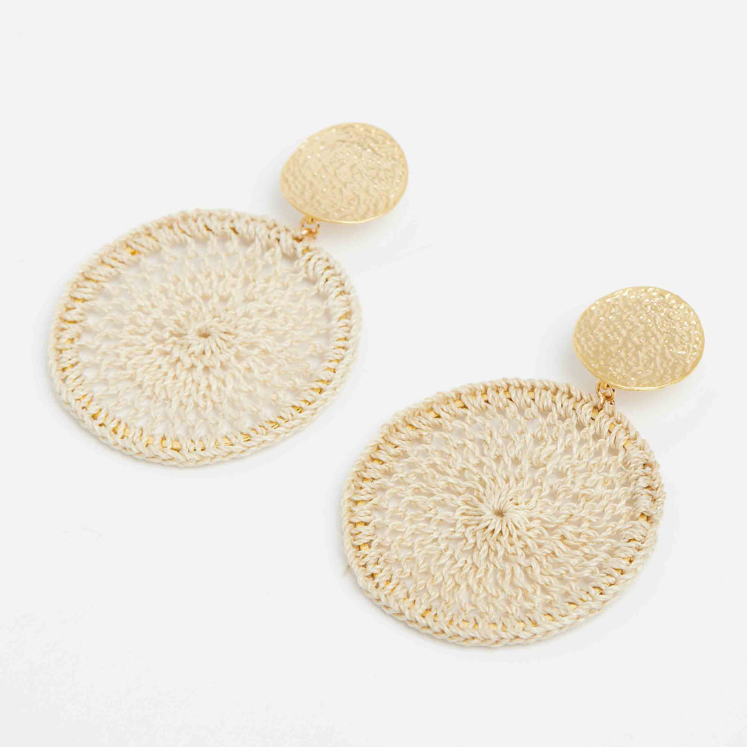 Natural fibre and gold disc boho earrings view on angle
