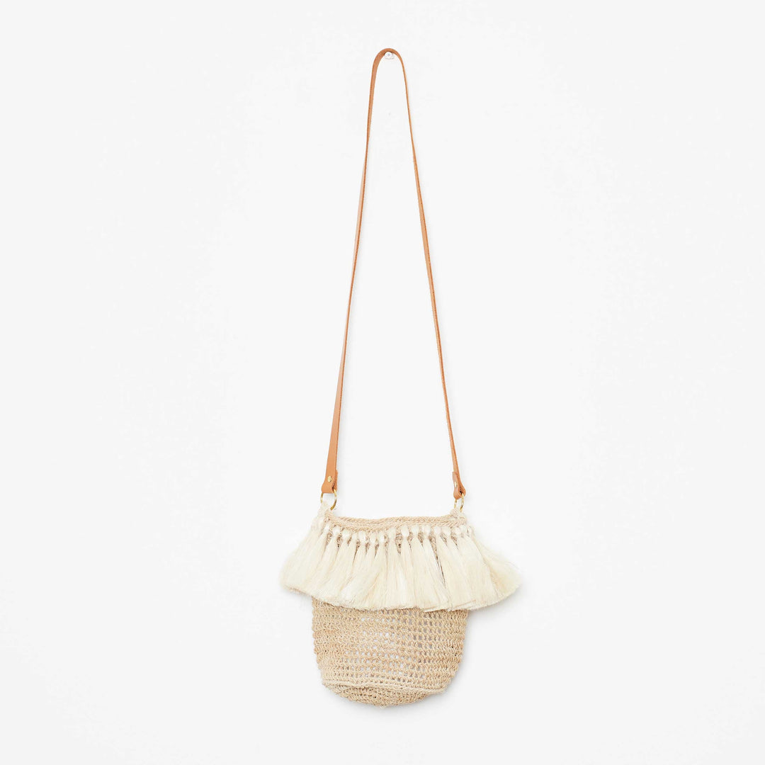 Fringed handwoven bag on a white background