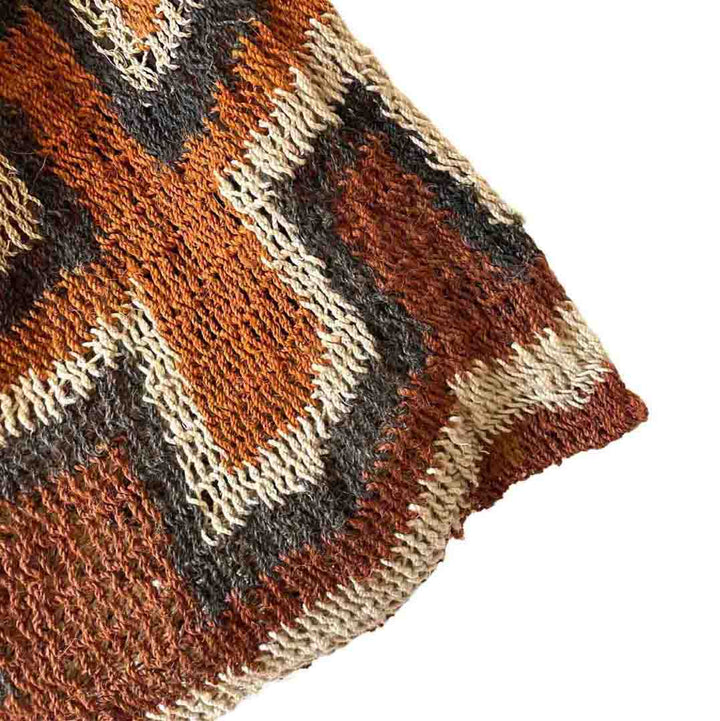 Corner close up on rust coloured traditional string bilum from Papua New Guinea.