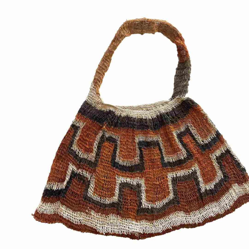 Rust coloured traditional string bilum from Papua New Guinea laid flat on a white background.