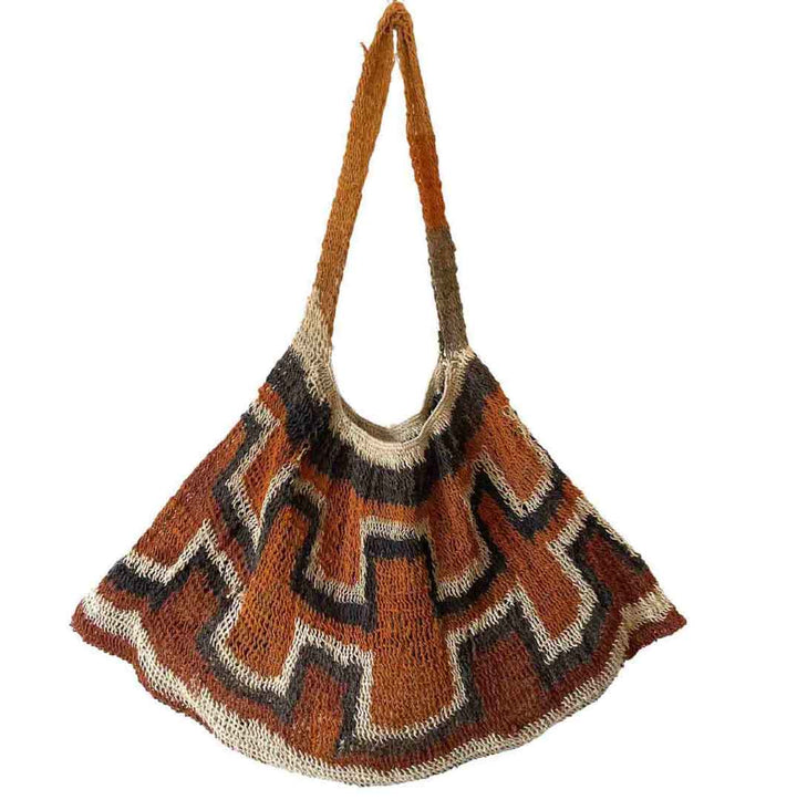 Rust coloured traditional string bilum from Papua New Guinea displayed on a white background.