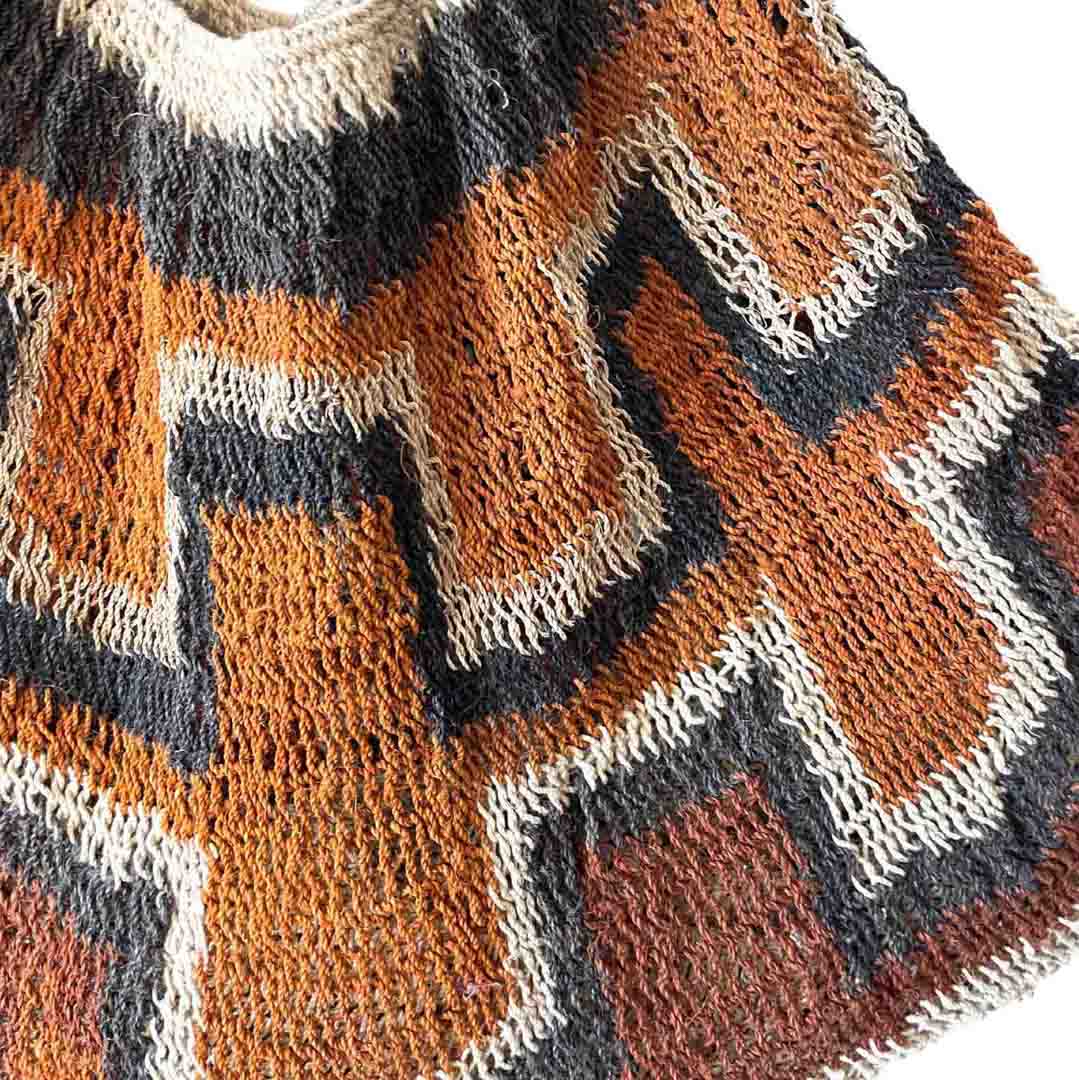Close up on weaving of rust coloured traditional string bilum from Papua New Guinea.