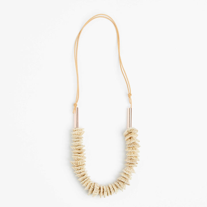 Full view of the Bilum and Bilas Lewa textile necklace with stacked handwoven and rose gold bead