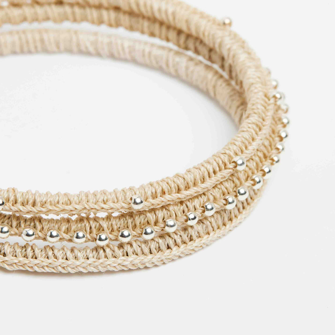 Close up on silver beaded Nambis luxury woven bangle set