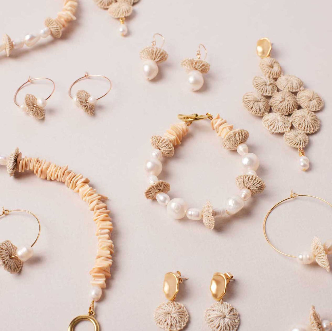Pearl stack bracelet in collection flat lay