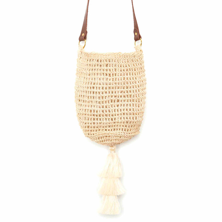 Close up of a natural fibre woven bucket bag.