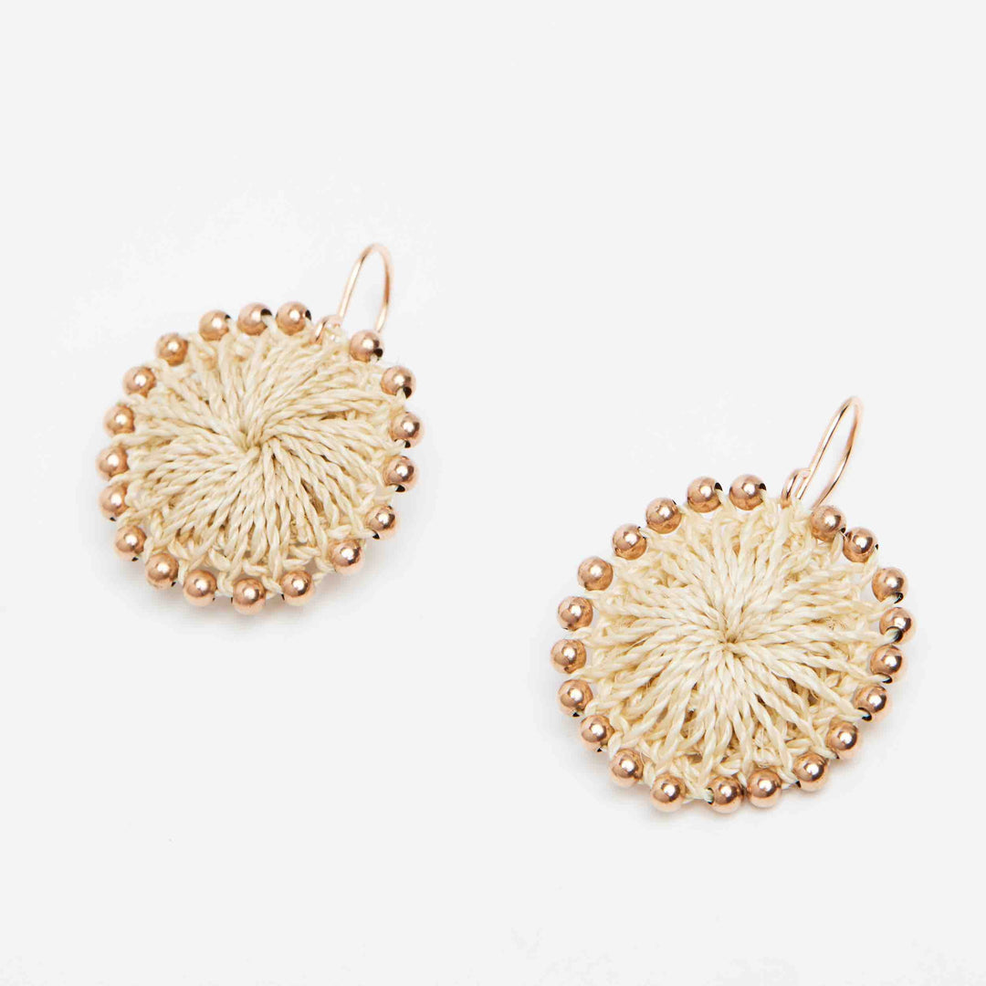 Rose gold beaded natural woven earring angle view