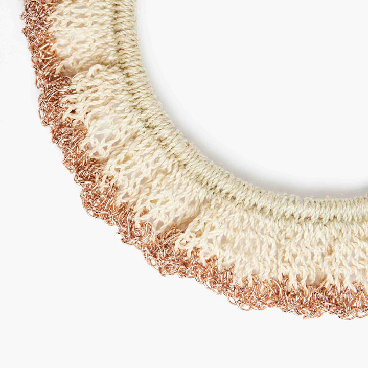 Natural fibre and rose gold metallic ruffle bracelet close up.