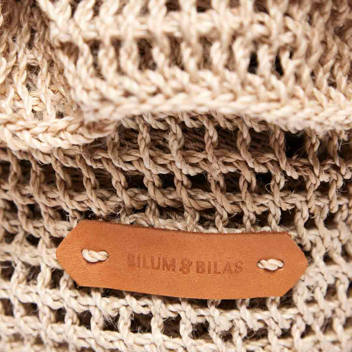 Logo detail of the natural woven ripple basket.