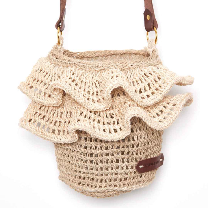 Detail of woven ruffle trims on Ripple Cross body bag in natural.