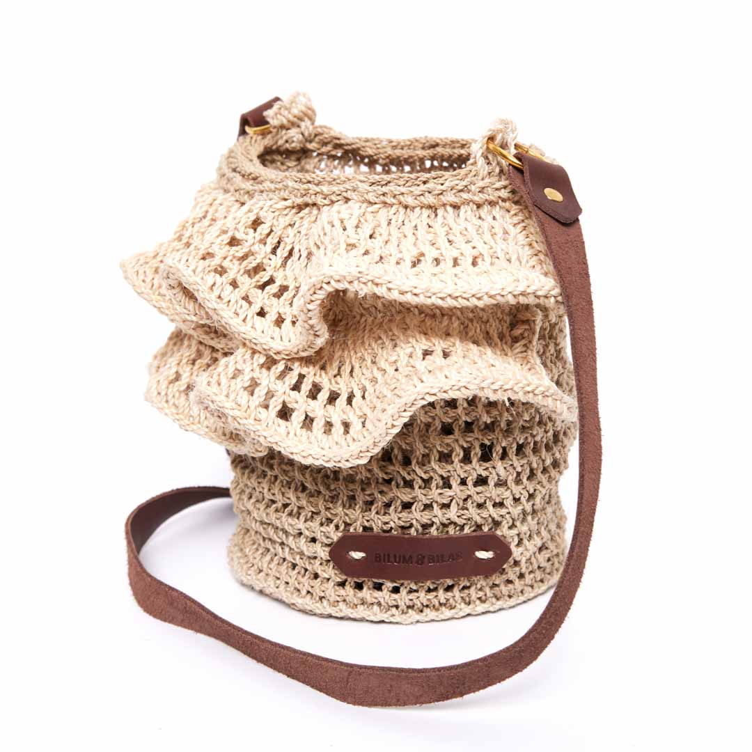 Side angle of the Ripple cross body bag in natural.