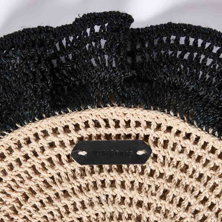 Detail close up on black ruffles on the Ripple clutch in black.