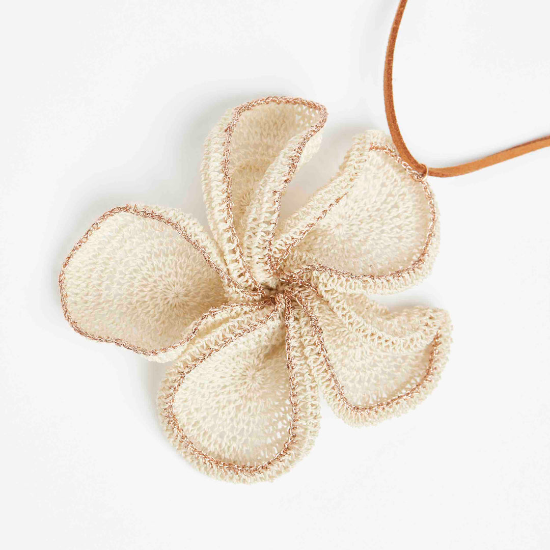 Natural fibre and metallic rose gold woven flower pendant side angle.
