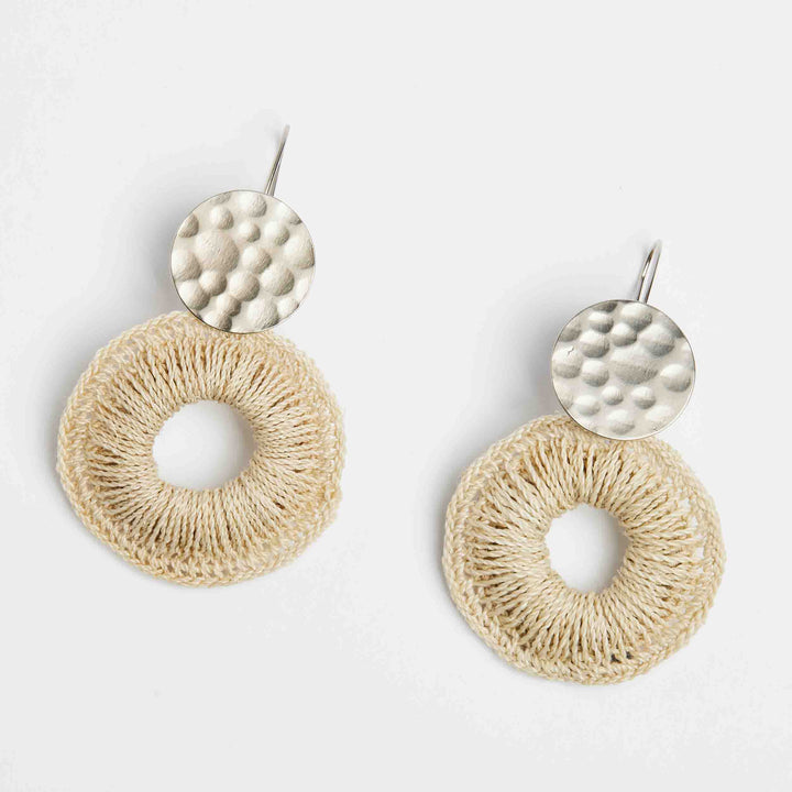 Bilum and Bilas silver disc earrings with natural fibre woven hoop earrings angled view