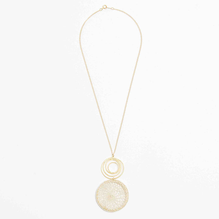 Gold filled fine chain necklace with gold swirl and natural fibre woven disc pendant front view