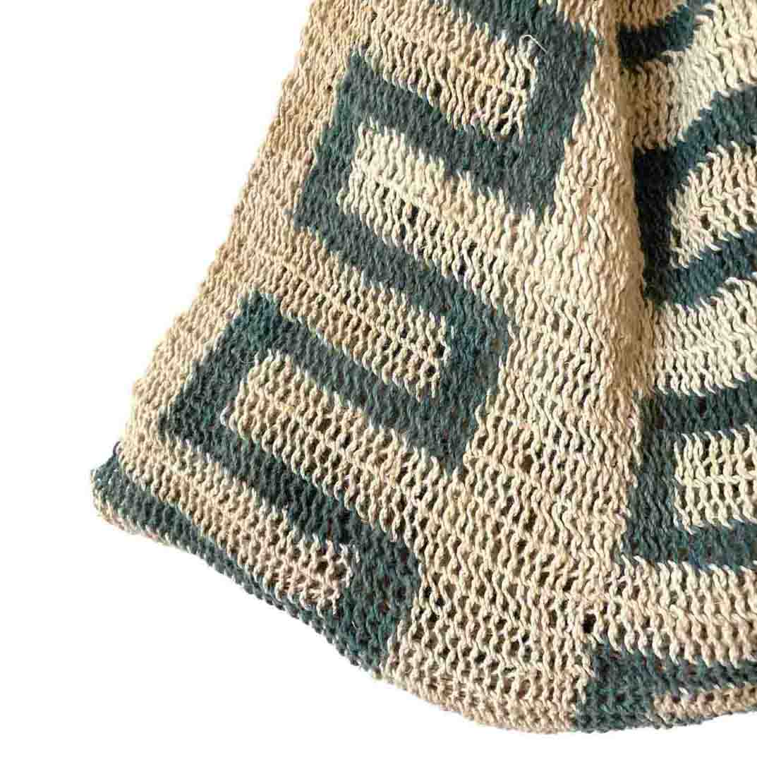 Close up on green lines patterned Umboldi Village string bilum.