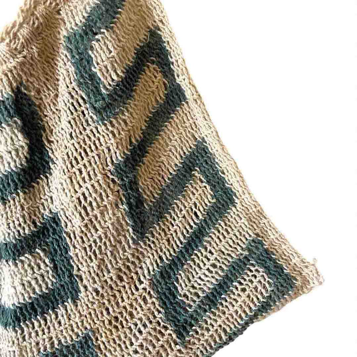 Corner of green lines patterned Umboldi Village string bilum.