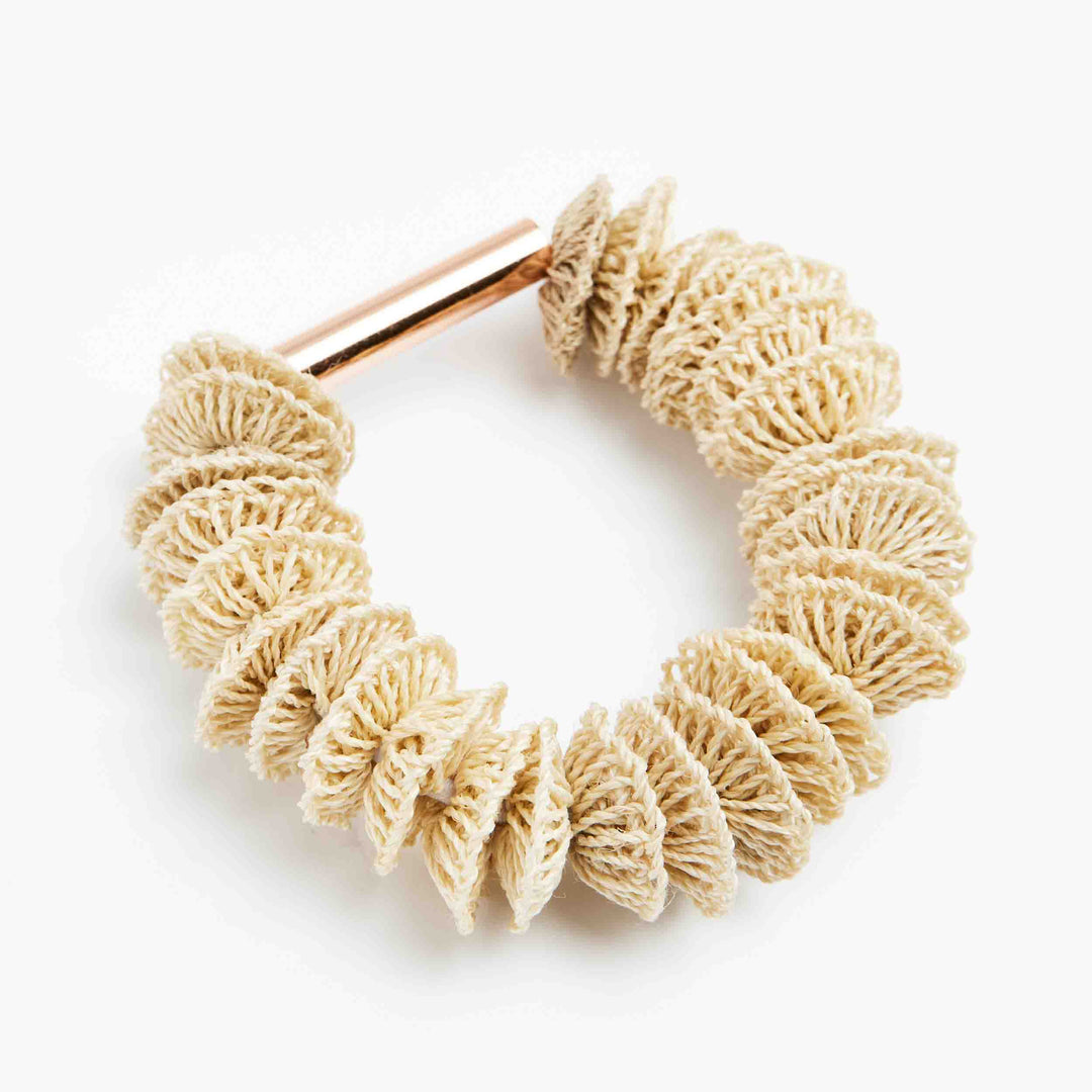 Bilum and Bilas Lewa stretch textile bead bracelet with a rose gold bead angle view.