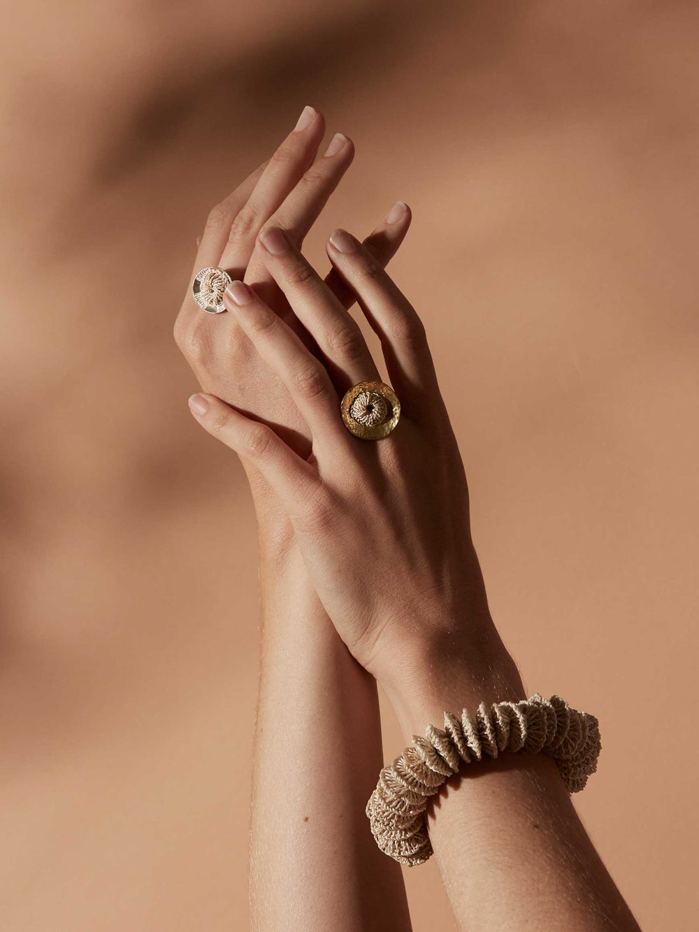 Bilum and Bilas Lewa stretch textile bead bracelet with a rose gold bead worn on a models wrist