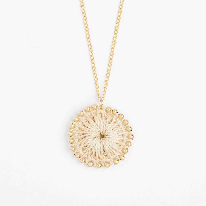 Close up on handwoven natural fibre pendant with gold filled beading. #Gold