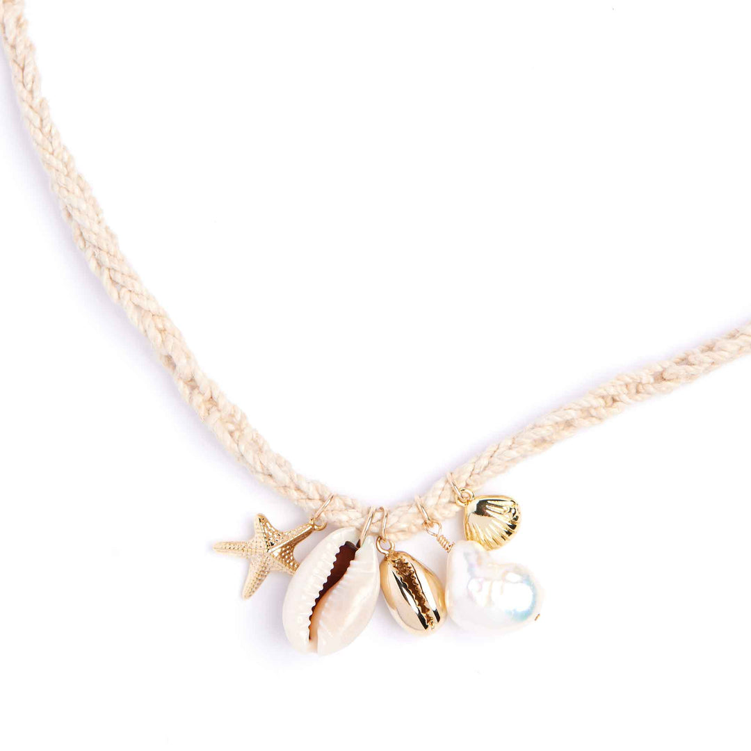 Necklace with starfish, shell, and pearl charm on a white background